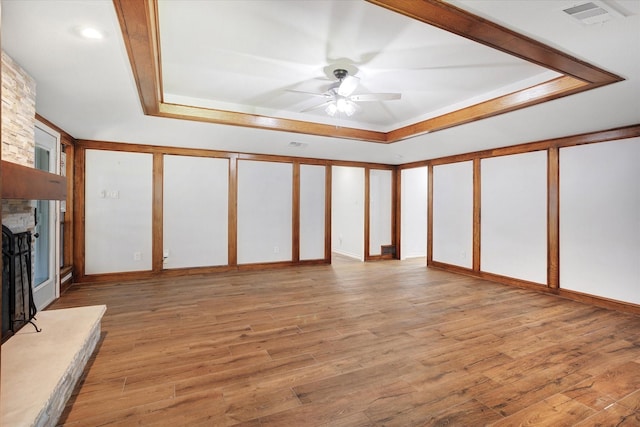 813 Grinnell Dr, Richardson, TX 75081 - unfurnished living room featuring a raised ceiling, ceiling fan, and wood finished floors