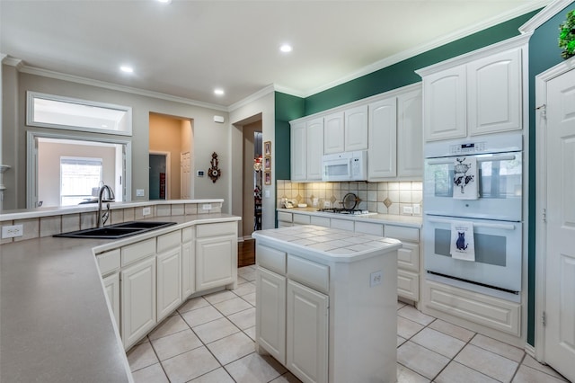 809 Lake Point Cir, Mckinney, TX 75072 - kitchen featuring recessed lighting, white appliances, decorative backsplash, tile countertops, and a sink