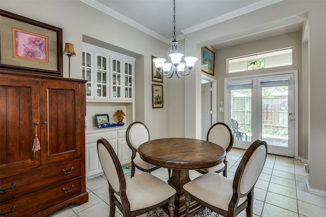 809 Lake Point Cir, Mckinney, TX 75072 - dining space with crown molding, light tile patterned flooring, a notable chandelier, and baseboards