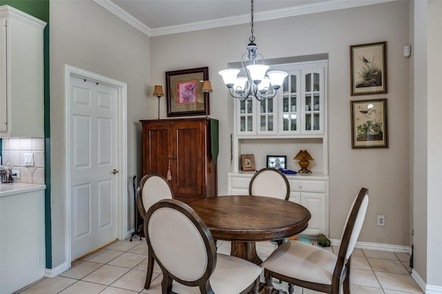 809 Lake Point Cir, Mckinney, TX 75072 - dining space featuring a chandelier, light tile patterned floors, baseboards, and ornamental molding
