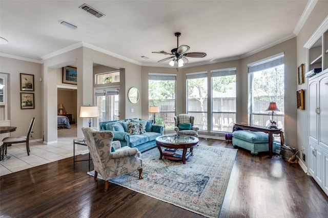 809 Lake Point Cir, Mckinney, TX 75072 - living area featuring wood finished floors, visible vents, ornamental molding, and ceiling fan