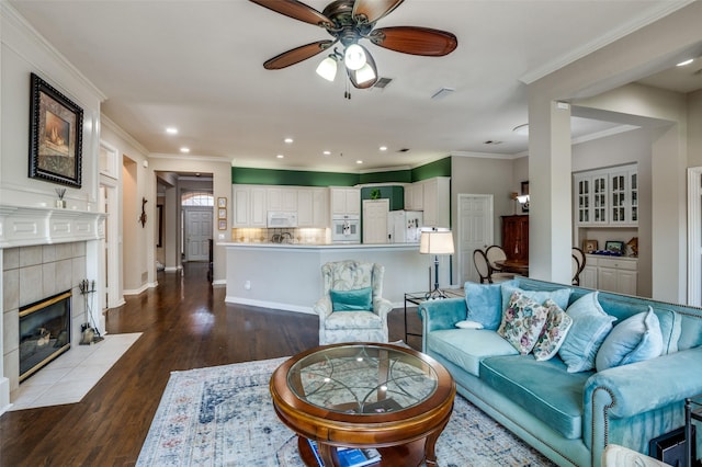 809 Lake Point Cir, Mckinney, TX 75072 - living area with dark wood-style floors, a fireplace, visible vents, and ceiling fan