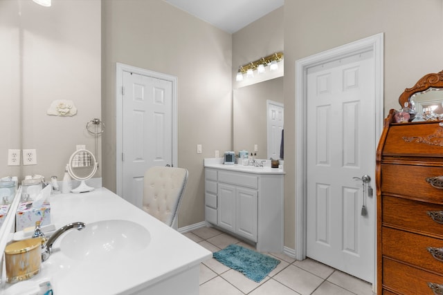 809 Lake Point Cir, Mckinney, TX 75072 - bathroom with tile patterned flooring, baseboards, a sink, and two vanities