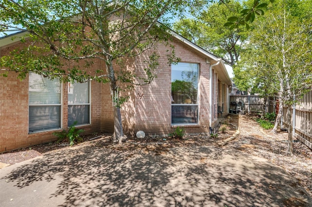 809 Lake Point Cir, Mckinney, TX 75072 - view of side of property featuring brick siding and fence