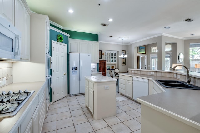 809 Lake Point Cir, Mckinney, TX 75072 - kitchen featuring tasteful backsplash, a center island, a sink, white appliances, and a chandelier