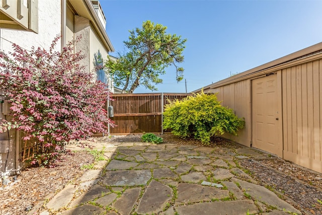 view of patio featuring fence