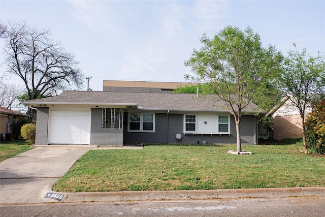 8820 Guadalupe Rd, Fort Worth, TX 76116 - ranch-style house with roof with shingles, a front lawn, brick siding, an attached garage, and driveway