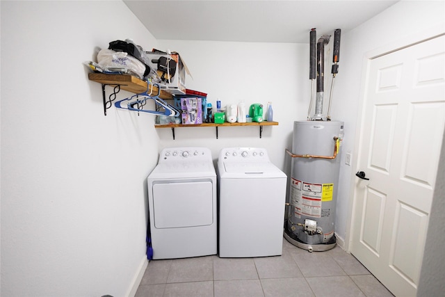 8820 Guadalupe Rd, Fort Worth, TX 76116 - clothes washing area featuring laundry area, separate washer and dryer, light tile patterned floors, and gas water heater