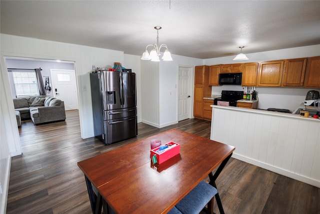 8820 Guadalupe Rd, Fort Worth, TX 76116 - dining room featuring dark wood-type flooring, baseboards, and an inviting chandelier