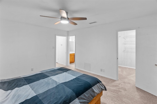 9518 County Road 913, Godley, TX 76044 - bedroom with a ceiling fan, a spacious closet, visible vents, light carpet, and baseboards