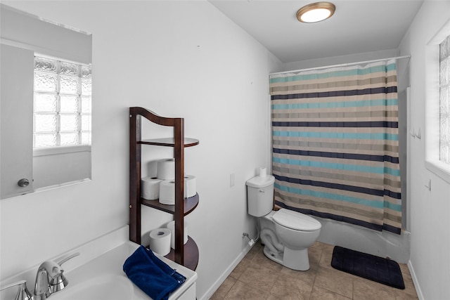 9518 County Road 913, Godley, TX 76044 - full bathroom with shower / bath combination with curtain, tile patterned flooring, toilet, a sink, and baseboards