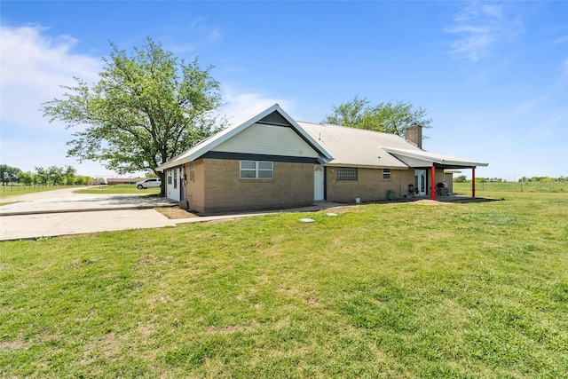 9518 County Road 913, Godley, TX 76044 - rear view of property featuring brick siding, a chimney, and a lawn