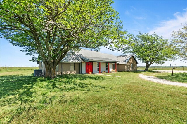 9518 County Road 913, Godley, TX 76044 - view of front of home featuring metal roof, a front yard, and central AC