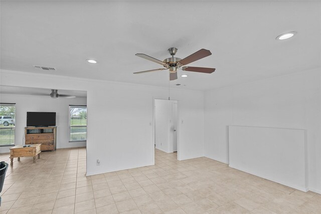 9518 County Road 913, Godley, TX 76044 - unfurnished living room with a wealth of natural light, recessed lighting, visible vents, and a ceiling fan