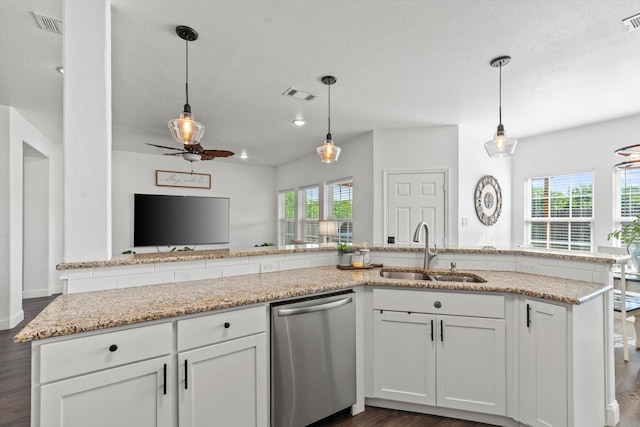 kitchen featuring dishwasher, a sink, visible vents, and plenty of natural light
