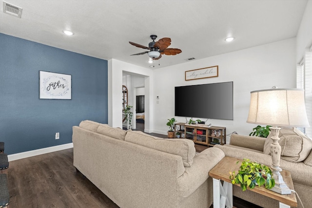 living area featuring visible vents, ceiling fan, recessed lighting, and dark wood finished floors