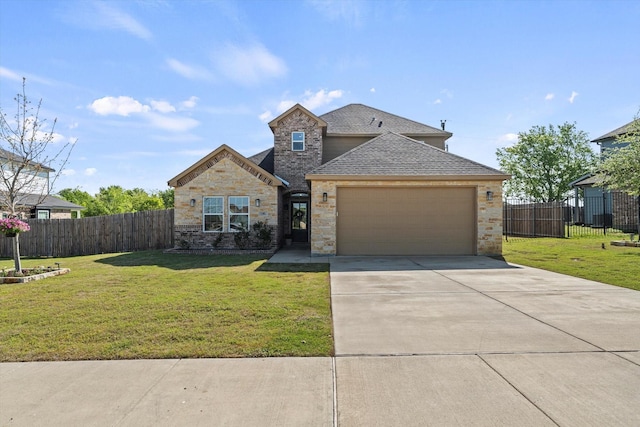 traditional-style house featuring concrete driveway, roof with shingles, a front lawn, a garage, and fence