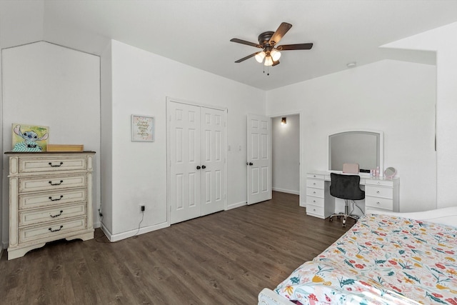 bedroom with a closet, baseboards, ceiling fan, and dark wood-style floors