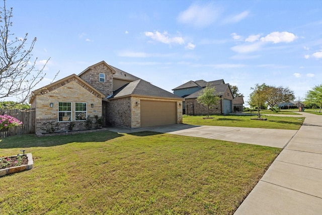 traditional-style home featuring fence, stone siding, a front lawn, an attached garage, and driveway