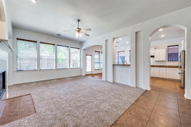 2612 Katie Trl, Melissa, TX 75454 - unfurnished living room featuring ceiling fan, light tile patterned floors, baseboards, recessed lighting, and a sink