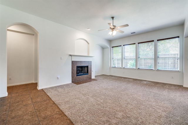 2612 Katie Trl, Melissa, TX 75454 - unfurnished living room featuring ceiling fan, a tile fireplace, baseboards, tile patterned floors, and carpet flooring