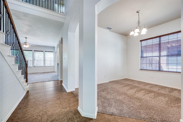 2612 Katie Trl, Melissa, TX 75454 - carpeted entrance foyer with arched walkways, a chandelier, stairs, baseboards, and tile patterned floors