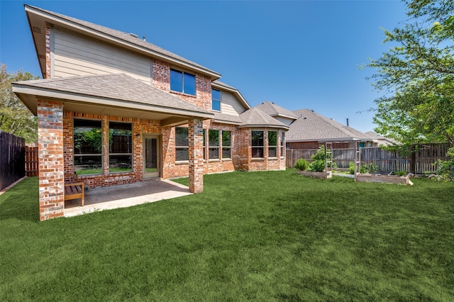 2612 Katie Trl, Melissa, TX 75454 - rear view of house featuring brick siding, a patio, a garden, and roof with shingles