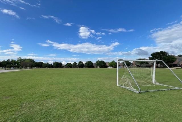 view of property's community featuring an area for sports