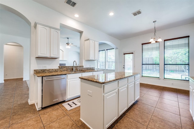 2612 Katie Trl, Melissa, TX 75454 - kitchen featuring dishwasher, a sink, a center island, arched walkways, and ceiling fan