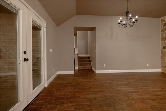 576 County Road 3555, Paradise, TX 76073 - unfurnished room with an inviting chandelier, dark wood finished floors, vaulted ceiling, stairway, and baseboards