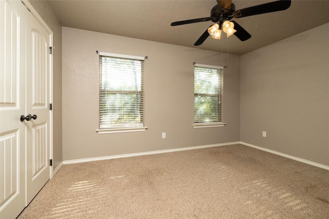 576 County Road 3555, Paradise, TX 76073 - empty room with ceiling fan, carpet flooring, and baseboards