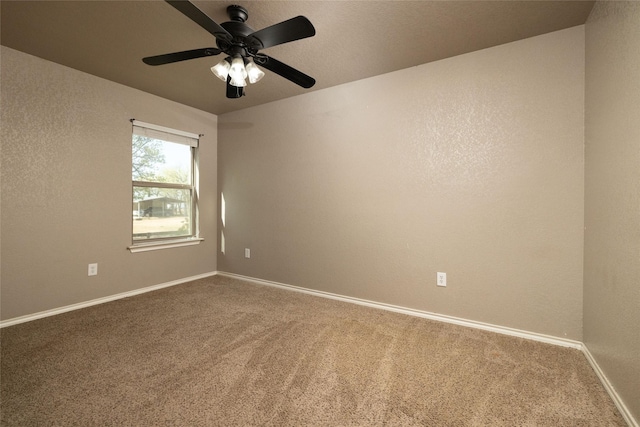 576 County Road 3555, Paradise, TX 76073 - spare room with carpet flooring, baseboards, and a ceiling fan