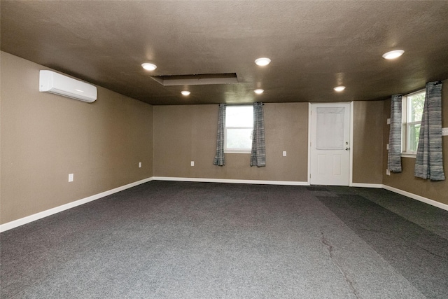 576 County Road 3555, Paradise, TX 76073 - basement with recessed lighting, a wall mounted AC, baseboards, and dark carpet
