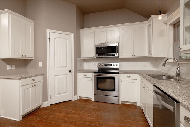 576 County Road 3555, Paradise, TX 76073 - kitchen featuring white cabinetry, appliances with stainless steel finishes, dark wood-style flooring, a sink, and backsplash