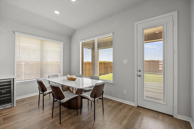 3506 Riley St, Fate, TX 75087 - dining room with recessed lighting, baseboards, wood finished floors, and wine cooler