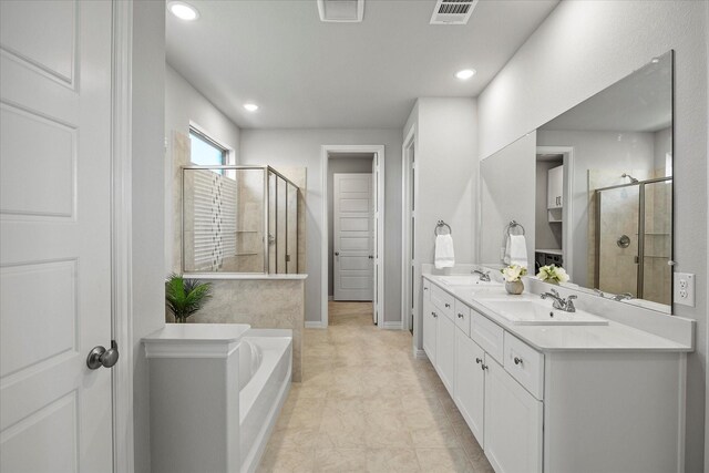 3506 Riley St, Fate, TX 75087 - full bath with a shower stall, double vanity, visible vents, and a sink