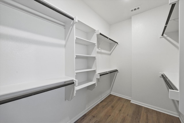 3506 Riley St, Fate, TX 75087 - walk in closet featuring dark wood-type flooring and visible vents
