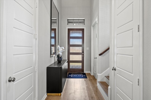3506 Riley St, Fate, TX 75087 - foyer entrance with light wood-type flooring, baseboards, and stairs