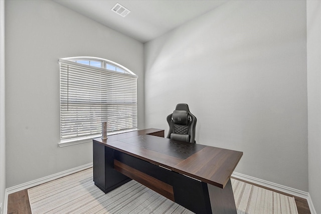 3506 Riley St, Fate, TX 75087 - home office with wood finished floors, baseboards, and visible vents