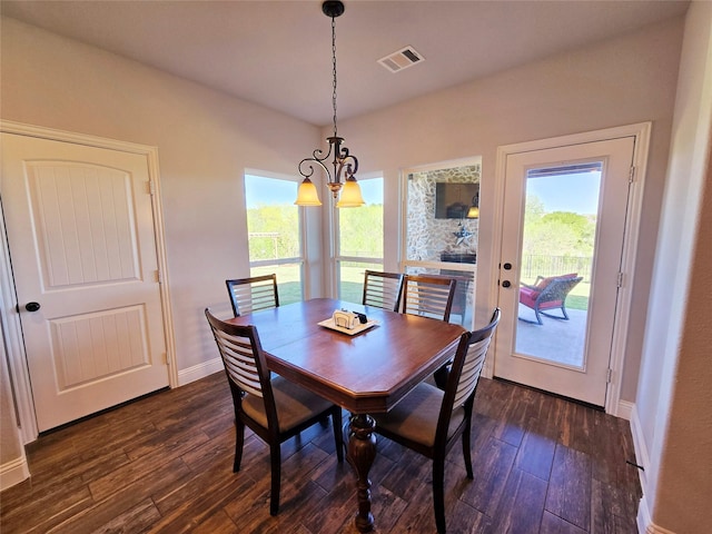 9812 El Colina Dr, Fort Worth, TX 76179 - dining space with a chandelier, visible vents, baseboards, and dark wood-style floors