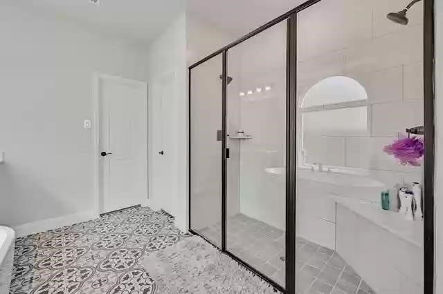 9812 El Colina Dr, Fort Worth, TX 76179 - bathroom with tile patterned floors and a stall shower