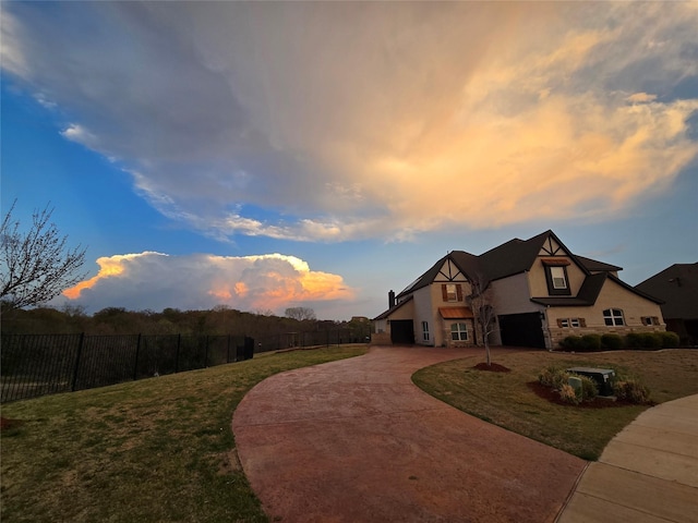 9812 El Colina Dr, Fort Worth, TX 76179 - view of front of property with a front lawn, fence, curved driveway, and stucco siding
