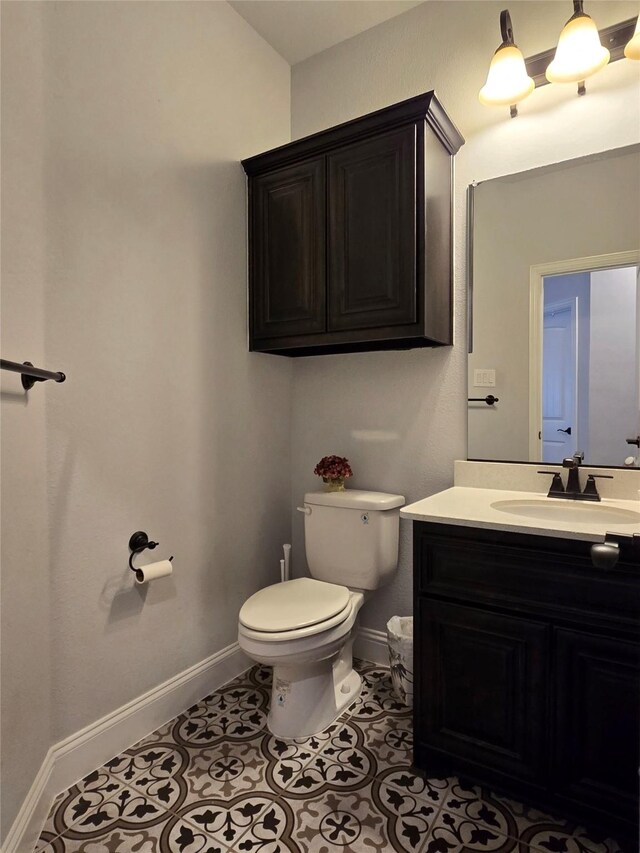 9812 El Colina Dr, Fort Worth, TX 76179 - half bathroom with toilet, tile patterned floors, vanity, and baseboards