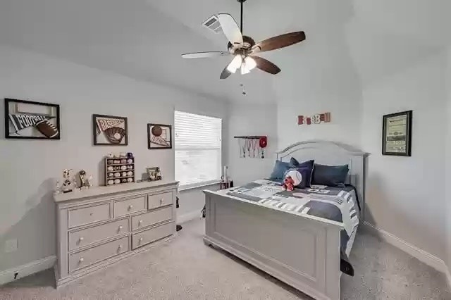 9812 El Colina Dr, Fort Worth, TX 76179 - bedroom with baseboards and ceiling fan