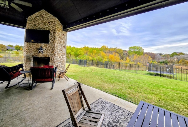 9812 El Colina Dr, Fort Worth, TX 76179 - view of patio / terrace with a trampoline, a fenced backyard, and an outdoor stone fireplace