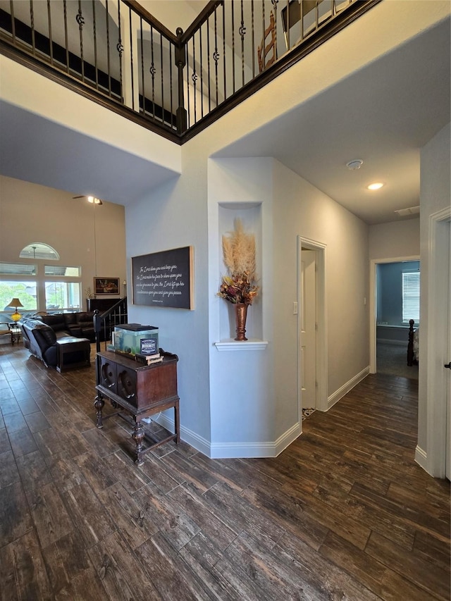 9812 El Colina Dr, Fort Worth, TX 76179 - hall featuring a high ceiling, baseboards, and hardwood / wood-style floors