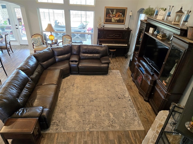 9812 El Colina Dr, Fort Worth, TX 76179 - living area with arched walkways and dark wood-style flooring