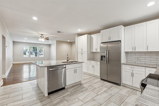 kitchen featuring visible vents, recessed lighting, a sink, stainless steel appliances, and backsplash