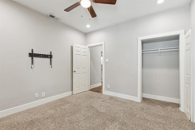unfurnished bedroom featuring carpet floors, baseboards, and visible vents