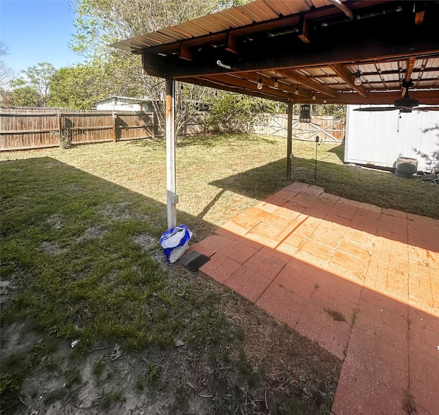 view of yard with a fenced backyard and a patio